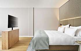 Sketch of a stylish bedroom with a bed and desk.